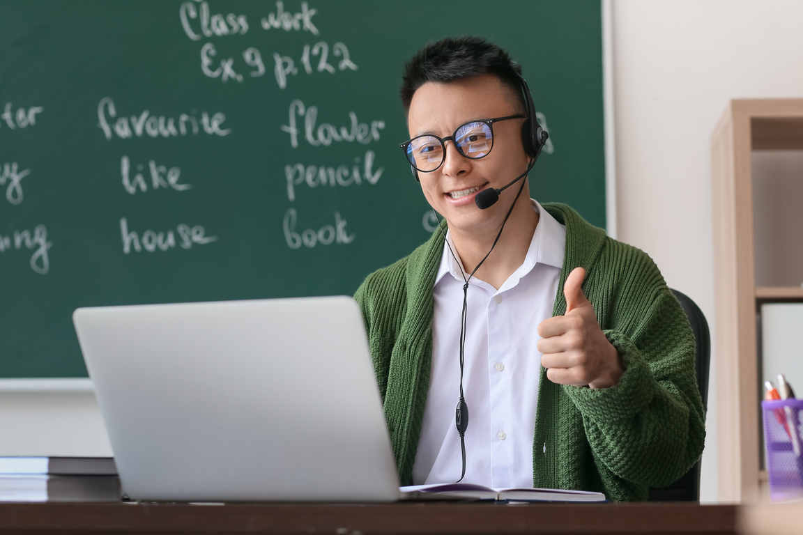 Asian Teacher Conducting English Lesson Online